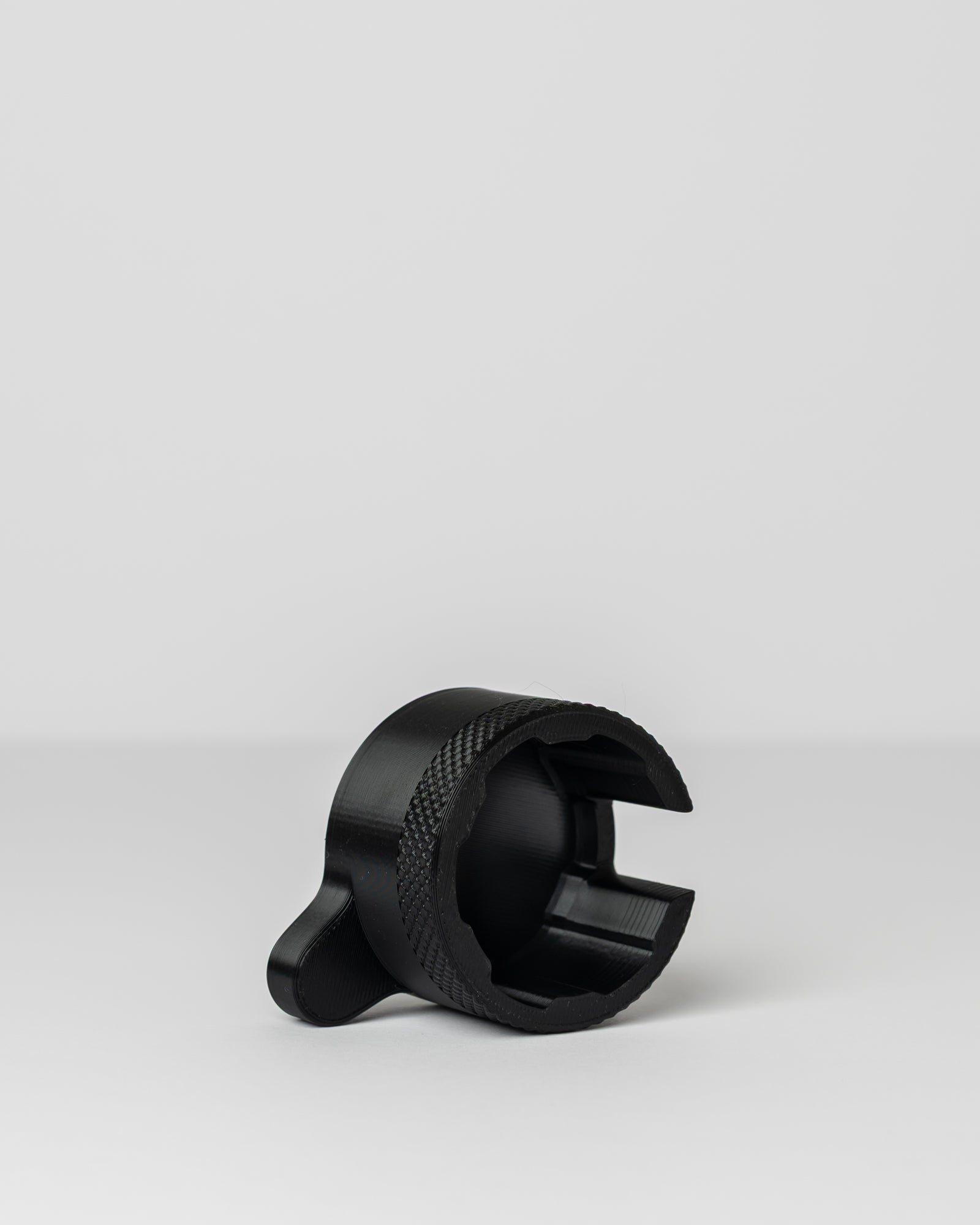 DIRT-EH radiator cap removal tool on a light gray background