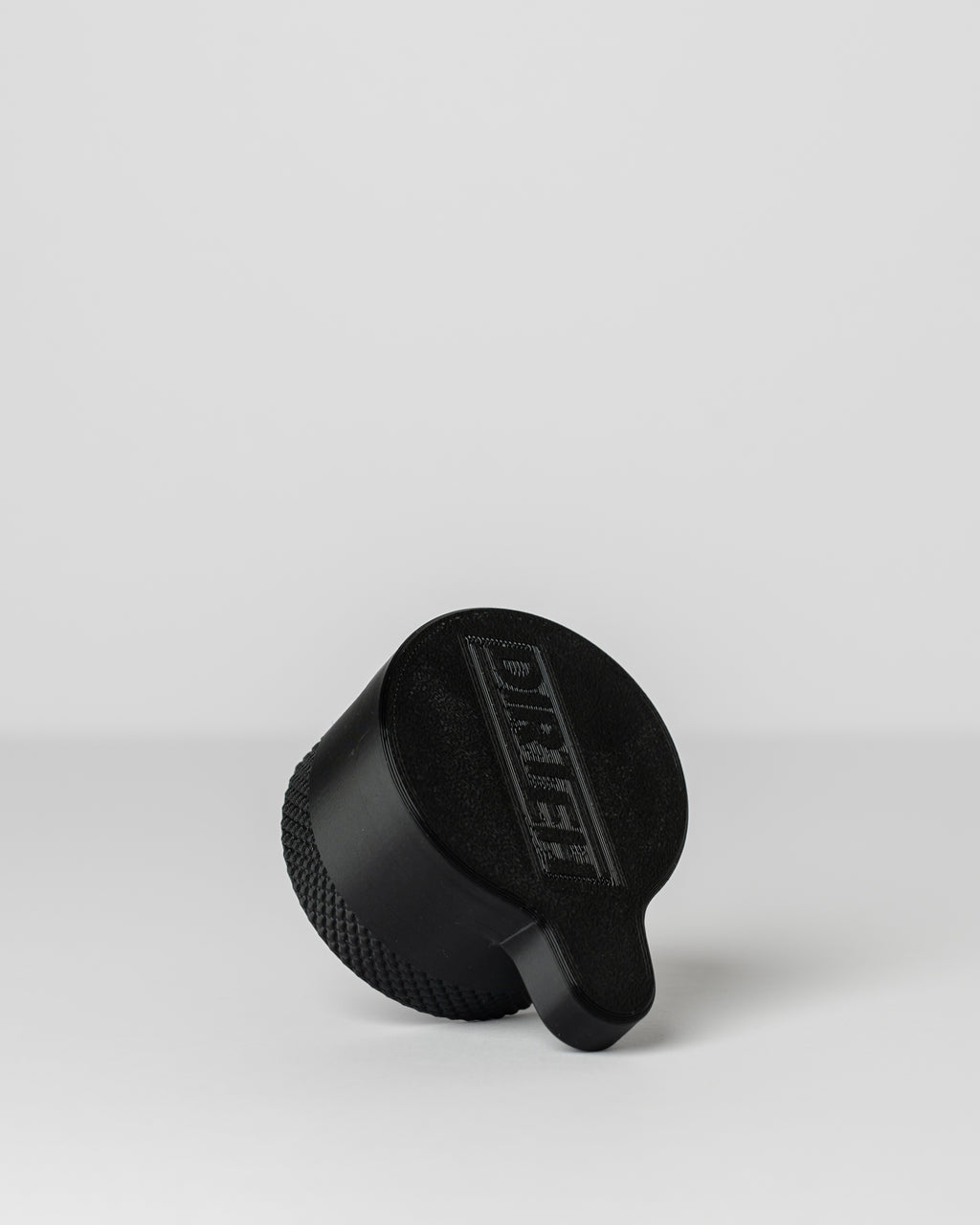 DIRT-EH radiator cap removal tool on a light gray background