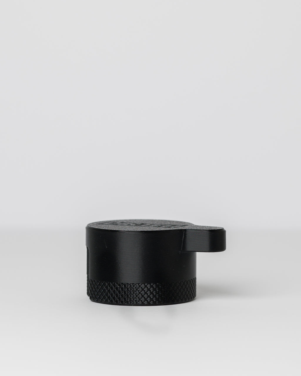 DIRT-EH radiator cap removal tool on a light gray background