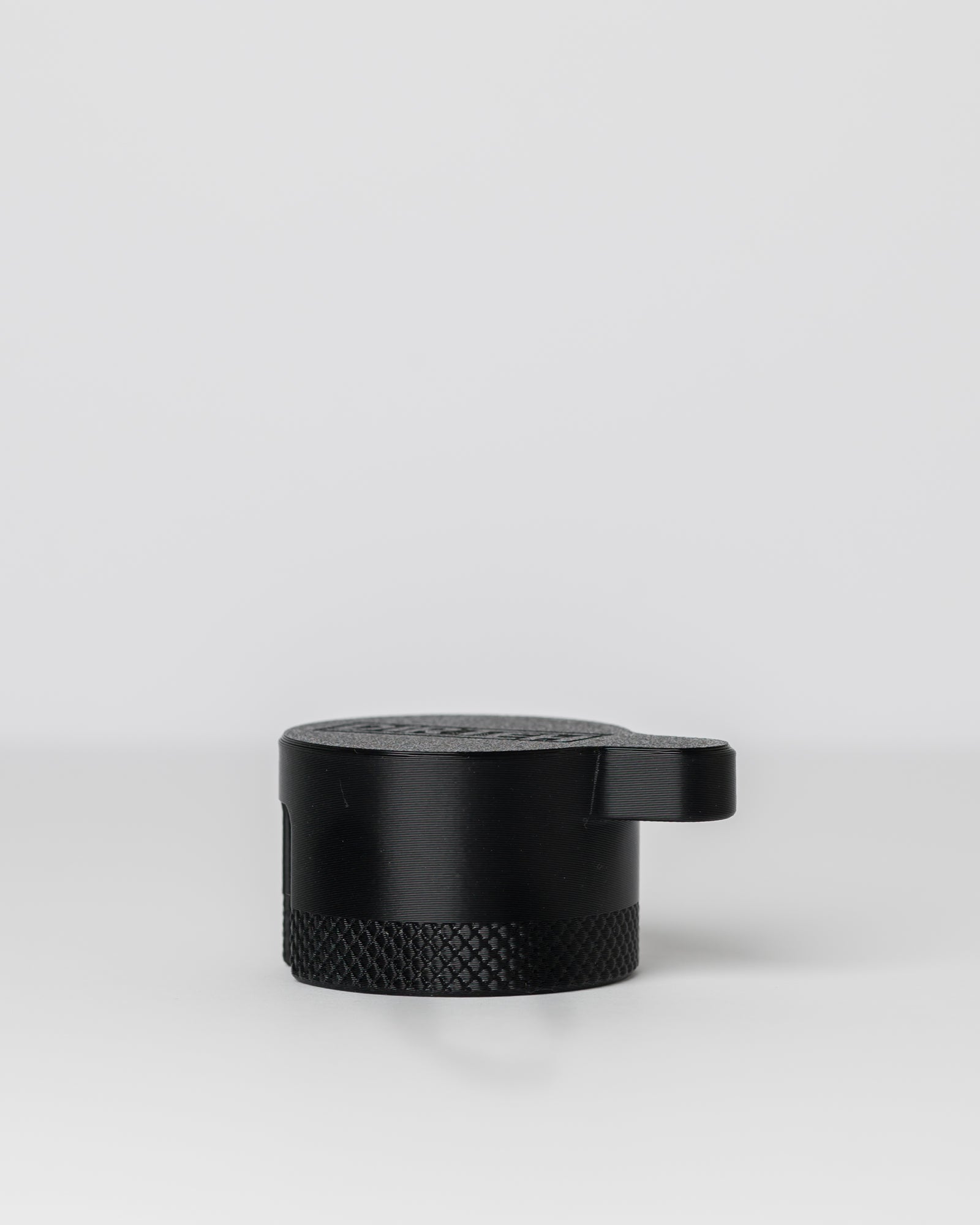 DIRT-EH radiator cap removal tool on a light gray background