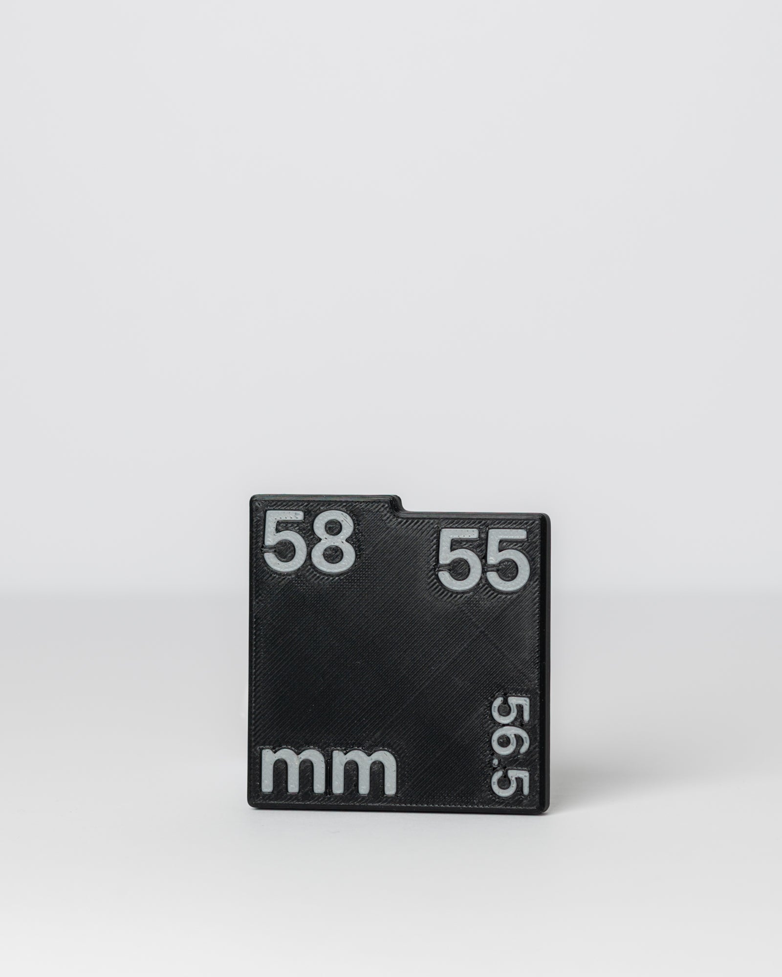 DIRT-EH chain slack gauge on a light gray background